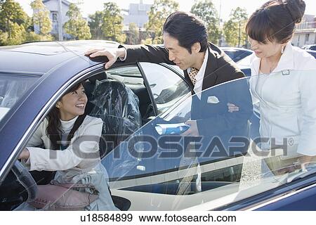 Japanese Family taking a test drive View Large Photo Image Stock Photo - Japanese Family taking a test drive. Fotosearch