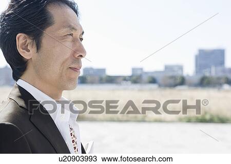 Stock Image - Japanese Man Looking Far. Fotosearch
