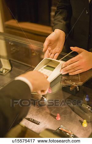 Stock Photo - Japanese Men, Payment. Fotosearch