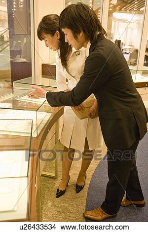 Japanese Woman Looking Of Jewelry View Large Photo Image Picture - Japanese Woman Looking Of Jewelry. Fotosearch