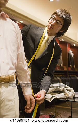 Salesclerk Measuring View Large Photo Image Stock Image - Salesclerk Measuring. Fotosearch
