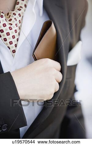 Picture - The Man Taking Out A Wallet. Fotosearch