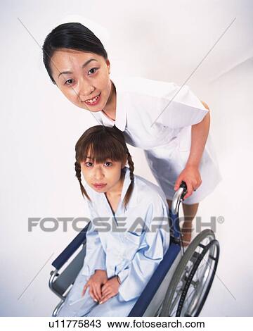Nurse and patient in wheelchair View Large Photo Image Stock Image - Nurse and patient in wheelchair . Fotosearch