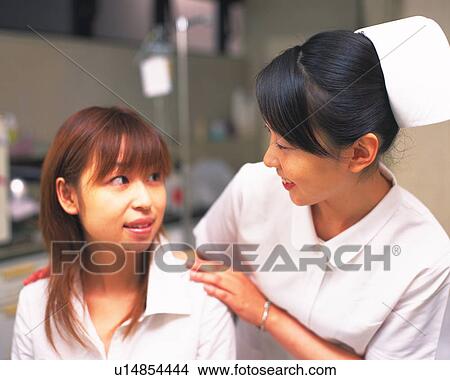 Nurse examining patient View Large Photo Image Picture - Nurse examining patient. Fotosearch