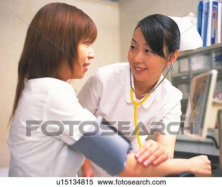 Stock Photography - Nurse taking male patient's blood pressure . Fotosearch