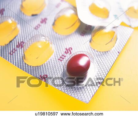 Stock Photo - Packet of red tablets . Fotosearch