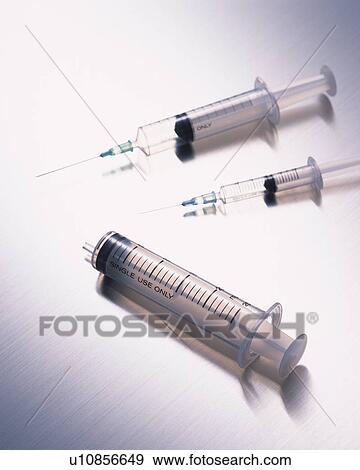 Stock Photo - Three syringes . Fotosearch