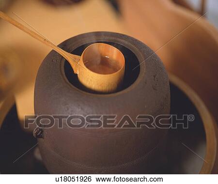 Bamboo dipper scooping hot water from tea kettle for tea ceremony, high angle view, close up, Japan, differential focus View Large Photo Image Stock Photograph - Bamboo dipper scooping hot water from tea kettle for tea ceremony, high angle view, close up, Japan, differential focus. Fotosearch