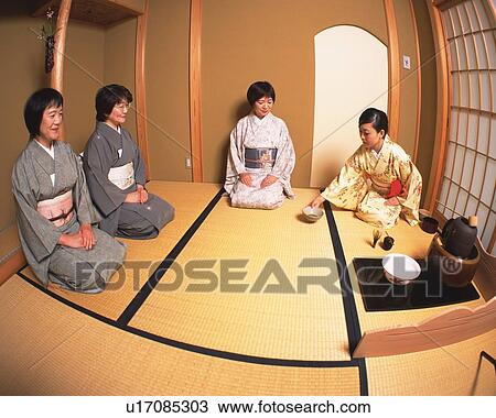Stock Image - Four women attending Japanese tea ceremony, high angle view, Japan, fish-eye lens. Fotosearch