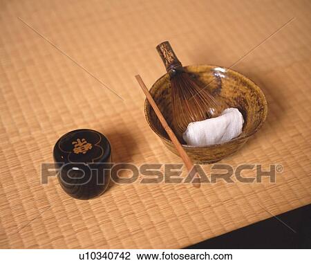 Stock Image - Japanese tea set on Tatami mat, high angle view, Japan. Fotosearch