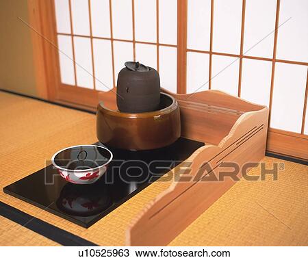 Stock Image - Japanese tea set on Tatami mat, high angle view, Japan. Fotosearch