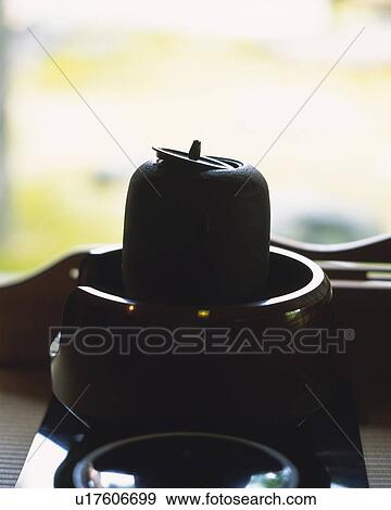 Stock Photo - Silhouette of Japanese tea set, high angle view, Japan, differential focus. Fotosearch
