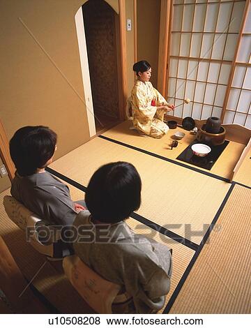 Three women attending Japanese tea ceremony, high angle view, Japan View Large Photo Image Stock Photo - Three women attending Japanese tea ceremony, high angle view, Japan. Fotosearch