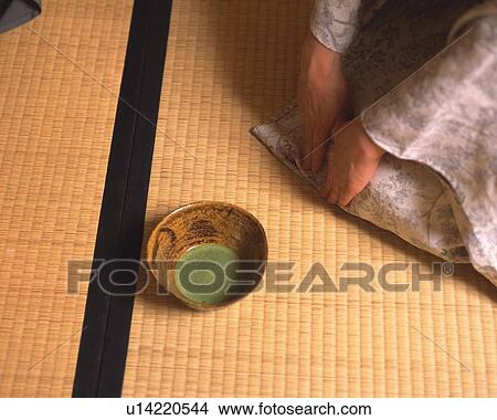Picture - Woman in kimono kneeling on Tatami mat at tea ceremony, high angle view, Japan. Fotosearch