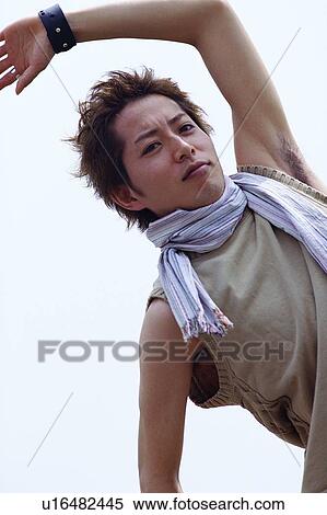 Stock Photography - Man dancing with arms outstretched . Fotosearch