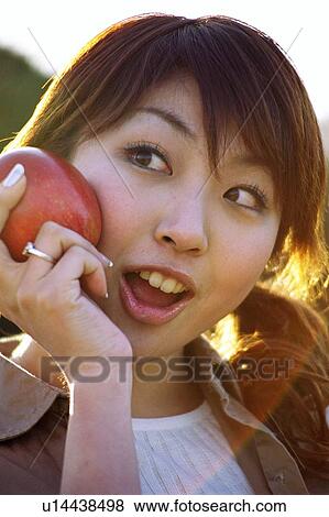 Stock Photo - Woman with apple . Fotosearch