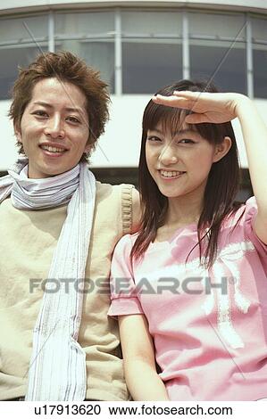 Young couple smiling, portrait View Large Photo Image Stock Image - Young couple smiling, portrait . Fotosearch