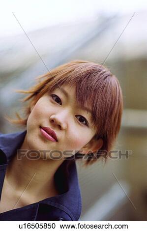 Stock Image - Young woman, portrait, close-up . Fotosearch