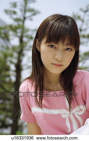 Stock Photograph - Young woman, portrait. Fotosearch