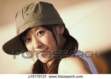 Young woman smiling, portrait View Large Photo Image Stock Image - Young woman smiling, portrait . Fotosearch