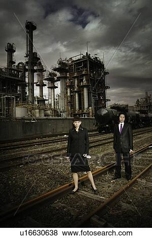 Stock Photo - Business Man and Business Woman at the Factory. Fotosearch