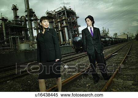 Stock Photography - Business Man and Business Woman at the Factory. Fotosearch