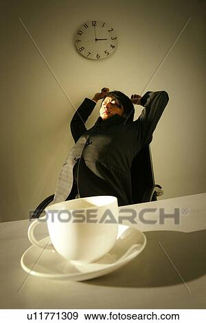 Business Man Stretching himself View Large Photo Image Stock Photo - Business Man Stretching himself. Fotosearch