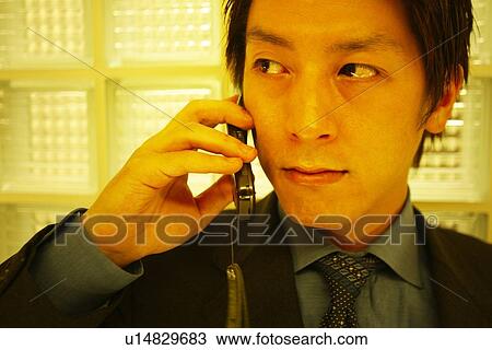 Stock Image - Business Man Talking on the Phone. Fotosearch