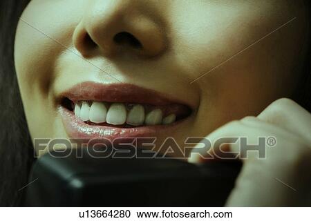 Stock Image - Business Woman Talking on the Phone. Fotosearch