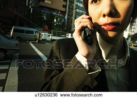 Business Woman Talking on the Phone View Large Photo Image Stock Photograph - Business Woman Talking on the Phone. Fotosearch