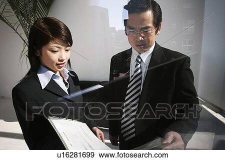 Business Man and Business Woman View Large Photo Image Stock Photo - Business Man and Business Woman. Fotosearch