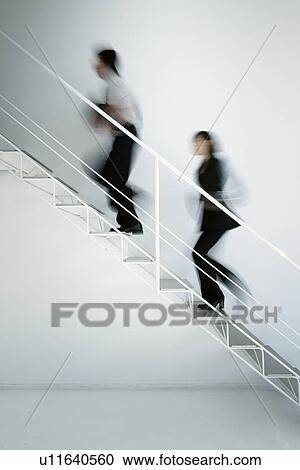 Business Man and Business Woman Walking Up Stairs View Large Photo Image Stock Image - Business Man and Business Woman Walking Up Stairs. Fotosearch