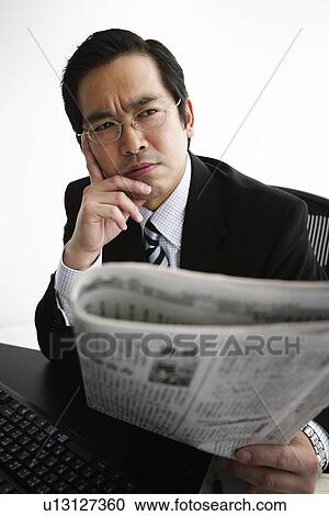 Business Man Reading a Newspaper View Large Photo Image Stock Image - Business Man Reading a Newspaper. Fotosearch