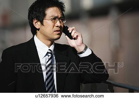 Stock Photograph - Business Man Talking on the Phone. Fotosearch