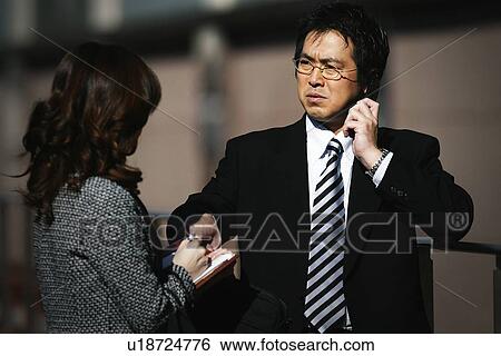 Stock Photograph - Business Man Talking on the Phone. Fotosearch