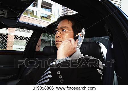 Stock Photograph - Business Man Talking on the Phone. Fotosearch