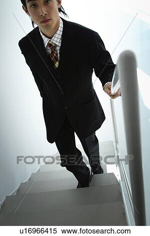 Business Man Walking Up Stairs Stock Photography U16966415