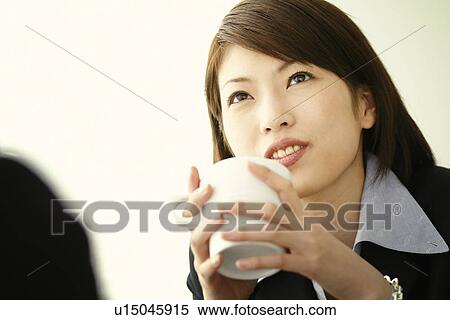 Stock Photography - Business Woman Drinking a Coffee. Fotosearch