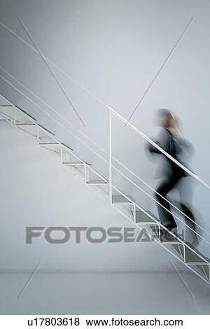 Stock Photo - Business Woman Walking Up Stair. Fotosearch