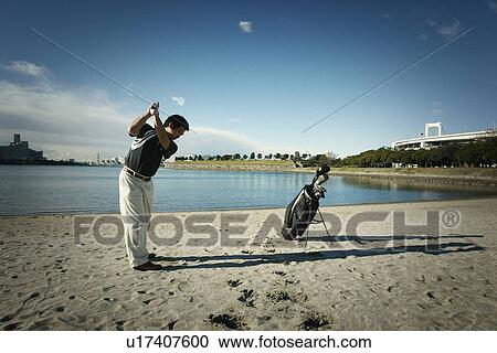 Mature Adult Man Playing Golf View Large Photo Image Stock Image - Mature Adult Man Playing Golf. Fotosearch