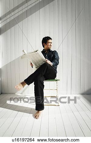 Picture - Mature Adult Man Reading a Newspaper. Fotosearch