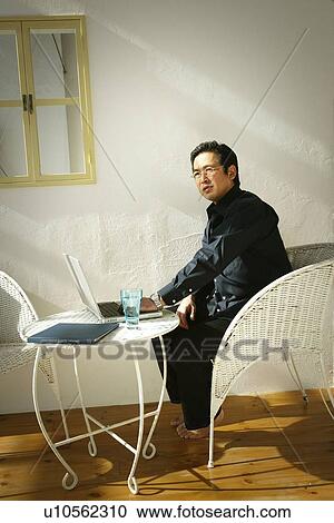 Stock Image - Mature Adult Man Working . Fotosearch
