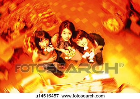 Stock Photo - Three Young Adult Women shopping. Fotosearch