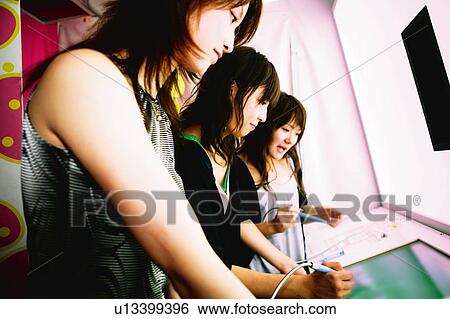 Stock Photograph - Three Young Adult Women. Fotosearch