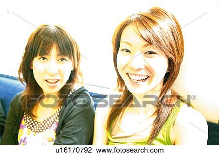 Two Young Adult Women on the Train View Large Photo Image Stock Image - Two Young Adult Women on the Train. Fotosearch