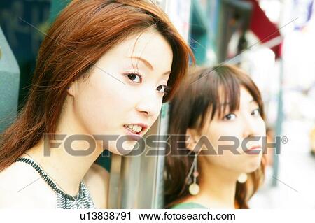 Stock Image - Two Young Adult Women. Fotosearch