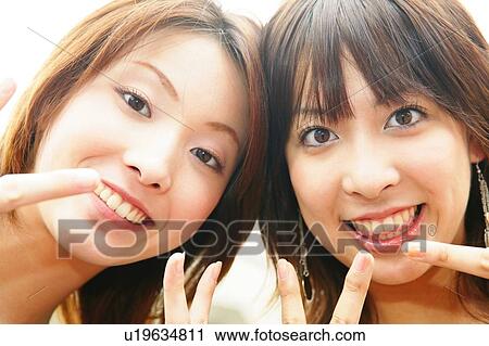 Stock Image - Two Young Adult Women. Fotosearch