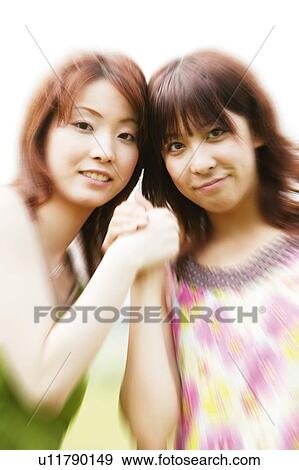 Stock Photo - Two Young Adult Women. Fotosearch