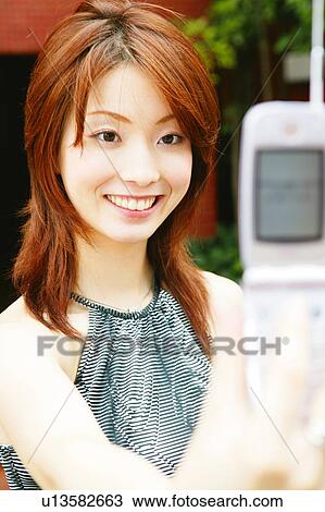 Two Young Adult Women Taking Photos View Large Photo Image Stock Image - Two Young Adult Women Taking Photos. Fotosearch