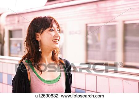 Young Adult Woman at the platform View Large Photo Image Stock Image - Young Adult Woman at the platform. Fotosearch